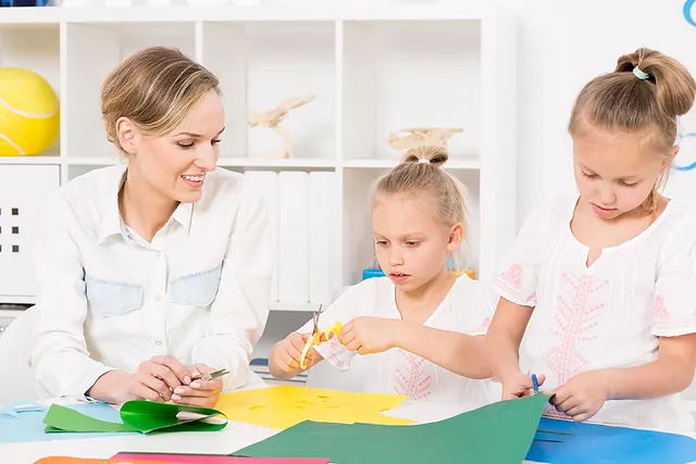 An Image of Children Interacting with a Member of Staff 